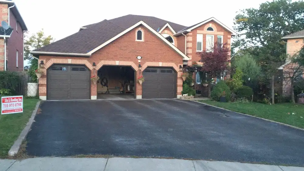 Roofing crew at work on a Barrie-area home